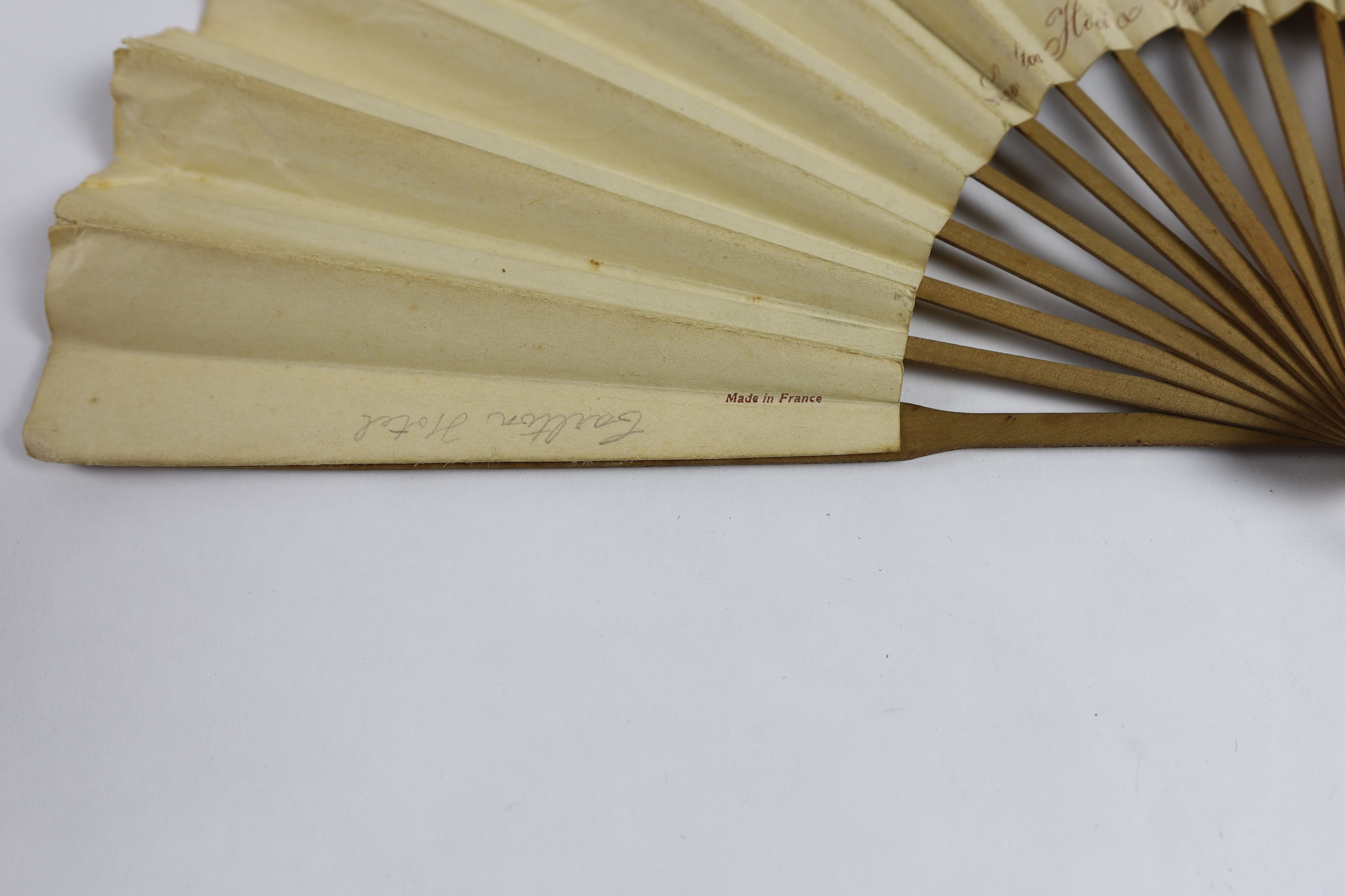 An unusual late 19th / early 20th century paper advertising fan for The Carlton Hotel, London (as printed on the back of fan leaf), signed on the front Georges Reson